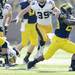 Michigan running back Fitzgerald Toussaint runs the ball against Iowa during the first quarter at Michigan Stadium. Melanie Maxwell I AnnArbor.com